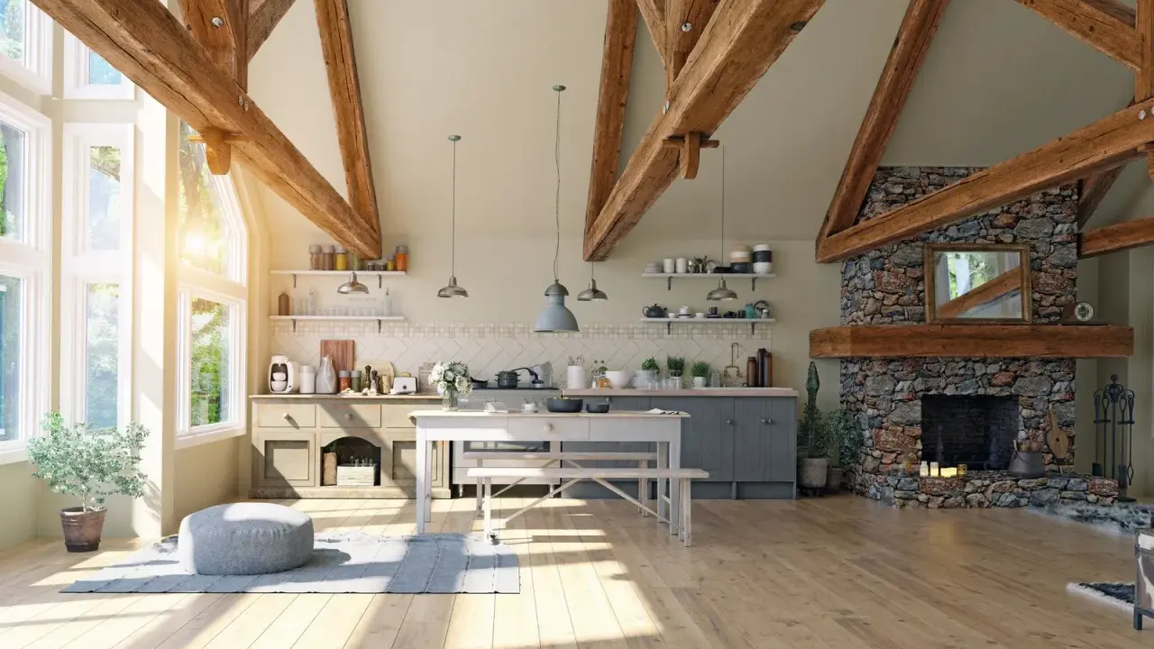Jasna kuchnia w stylu modern farmhouse z kamiennym kominkiem, drewnianymi belkami i dużymi oknami.