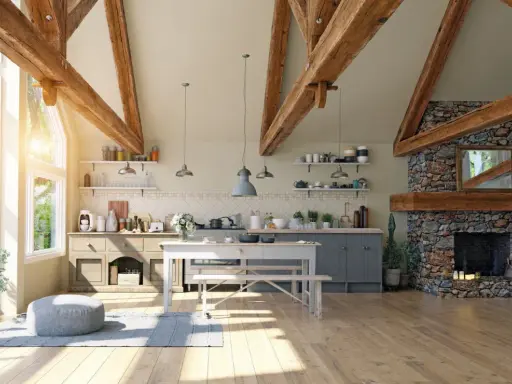 Jasna kuchnia w stylu modern farmhouse z kamiennym kominkiem, drewnianymi belkami i dużymi oknami.