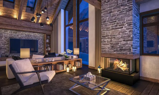 Przytulny salon w stylu chalet z kamiennym kominkiem, drewnianymi belkami i dużymi oknami.