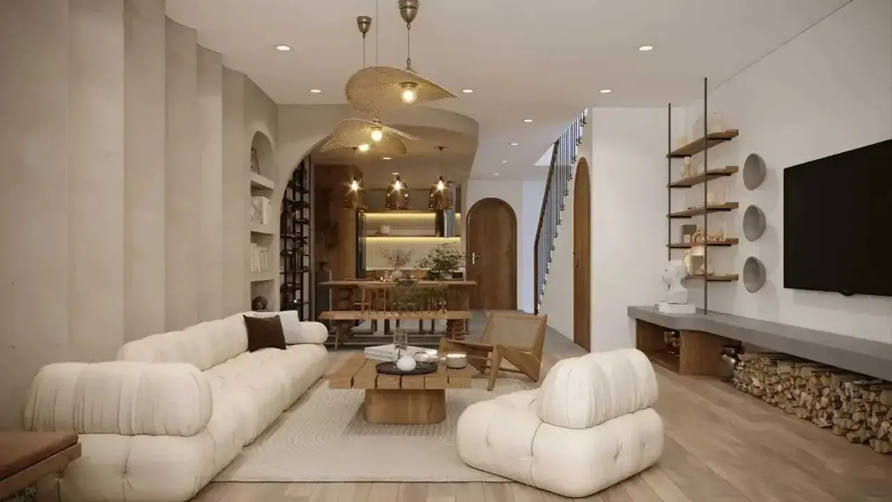 Jasny salon w stylu japandi z wygodną sofą, drewnianym stolikiem i jadalnią.